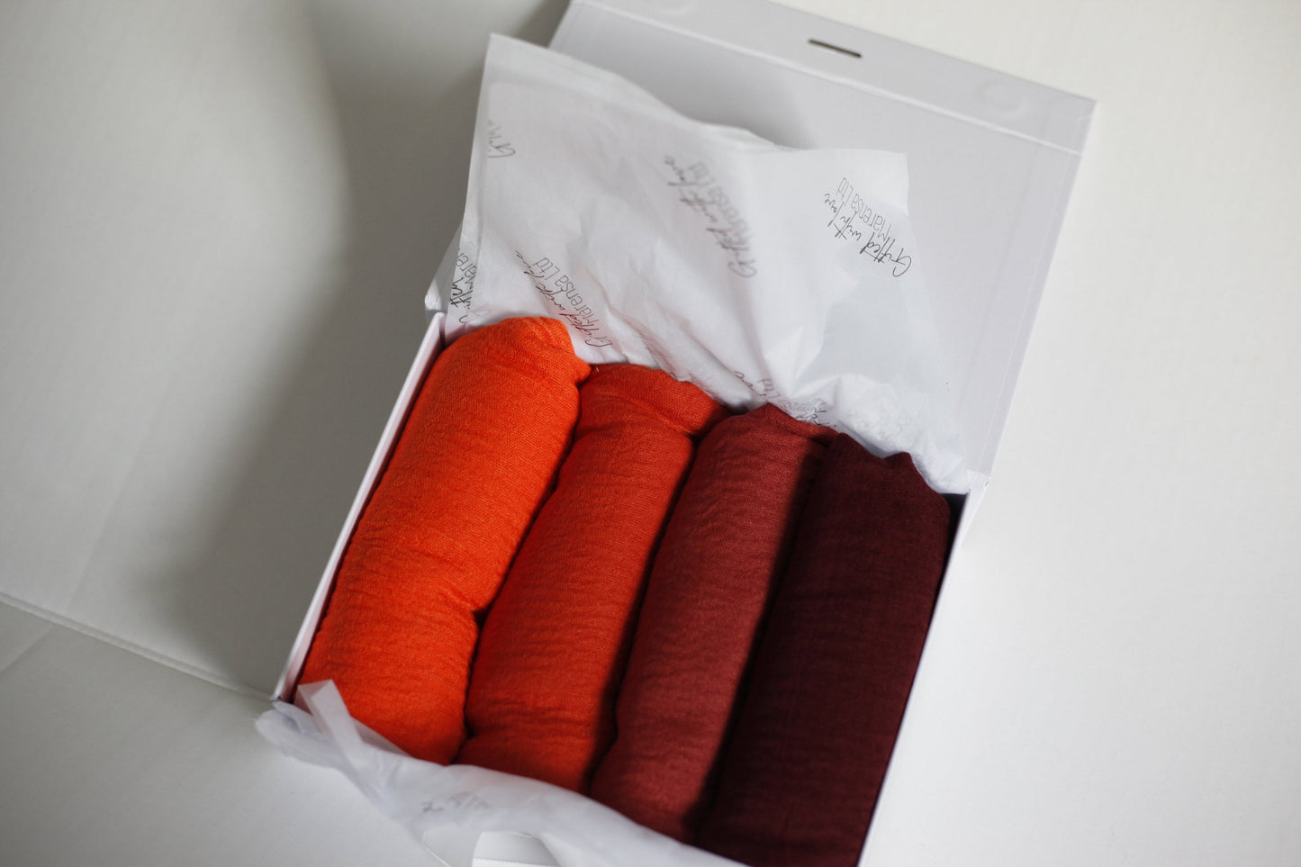 Shades of Orange and maroon crimple scarf with distressed edge, Perfect Eid Hijabs, or if you are gifting hijab gifts, perfectly boxed